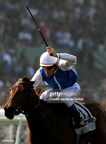 Jockey Olivier Peslier rides to the finish line to win the TVG Breeders' Cup Mile race with Goldikova during the Breeders' Cup World Championships at...