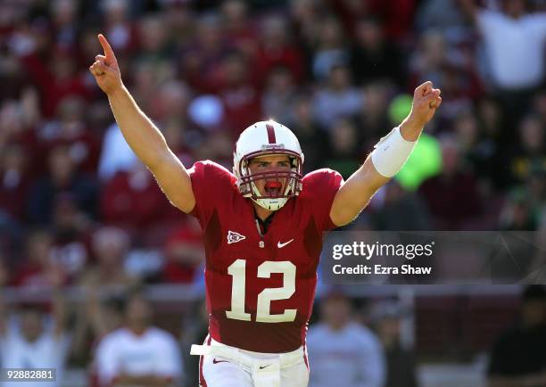 Andrew Luck of the Stanford Cardinal celebrates after the Cardinal scored a touchdown to go up 30-14 over the Oregon Ducks at Stanford Stadium on...