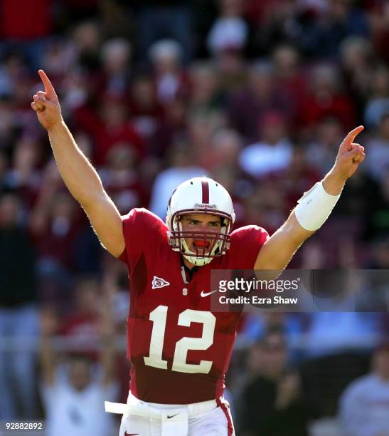 Andrew Luck of the Stanford Cardinal celebrates after the Cardinals scored a touchdown to go up 30-14 over the Oregon Ducks at Stanford Stadium on...