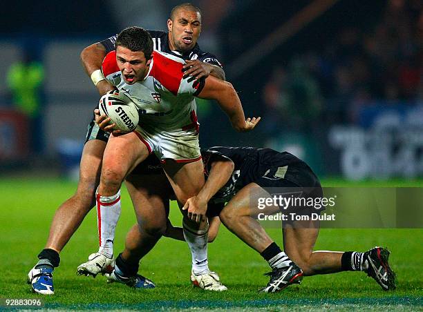 Sam Burgess of England is challenged during the Gillette Four Nations match between England and New Zealand at The Galpharm Stadium on November 07,...