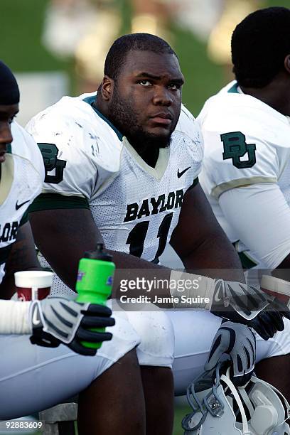 Defensive tackle Phil Taylor of the Baylor Bears watches from the bench during the game against the Missouri Tigers at Faurot Field at Memorial...