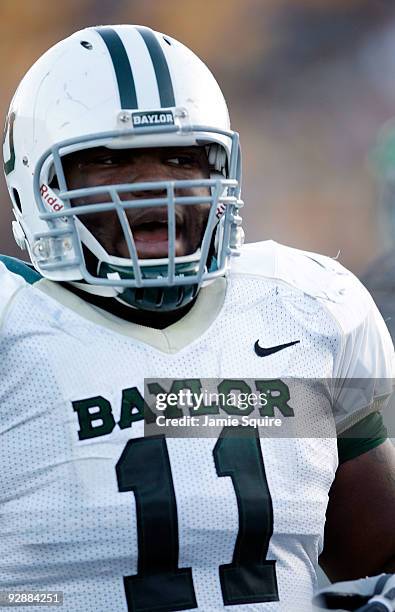 Defensive tackle Phil Taylor of the Baylor Bears watches from the bench during the game against the Missouri Tigers at Faurot Field/Memorial Stadium...