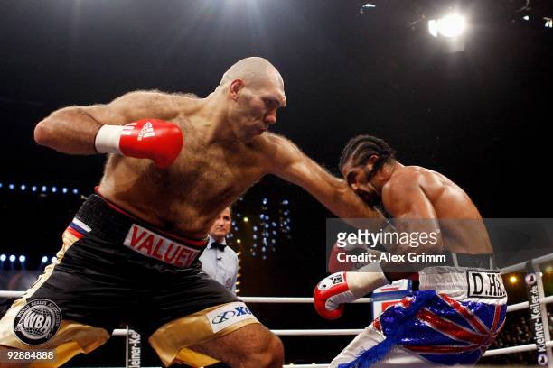 Heavyweight champion Nikolai Valuev of Russia lands a left before being defeated by David Haye of Britain in their WBA heavyweight championship fight...