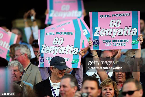 Fans hold signs of support for Zenyatta the Breeders' Cup World Championships at Santa Anita Park November 7, 2009 in Arcadia, California.