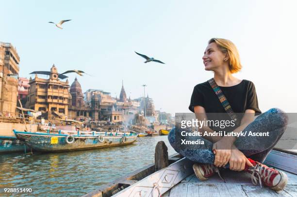 young woman explores the ganges by boat - tourism stock pictures, royalty-free photos & images