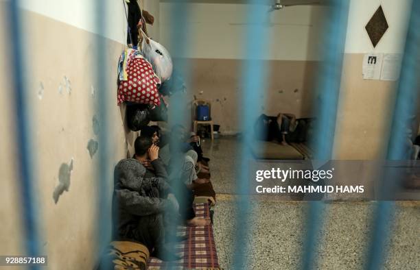 Palestinians who are unable to pay off their debts, sit in a cell in a Hamas jail in Gaza City on February 20, 2018. Over 40,000 Gazans were charged...