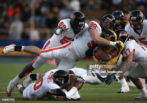 Verran Tucker of the California Golden Bears is tackled by Gabe Miller of the Oregon State Beavers at California Memorial Stadium on November 7, 2009...