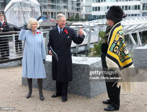 Prince Charles, Prince of Wales and Camilla, Duchess of Cornwall meet Wade Baker, a First Nation People, as they tour the 2010 Olympic Village Site...