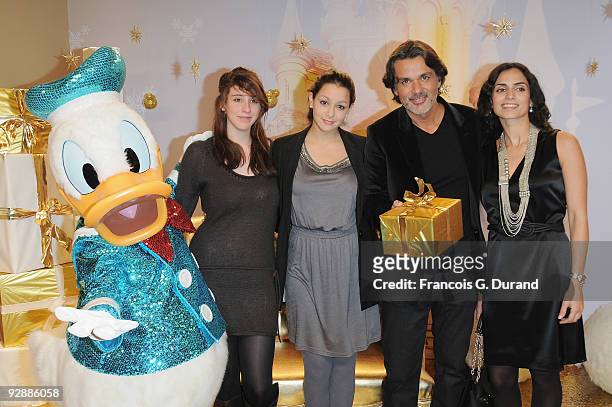 Director Christophe Barratier poses with his wife Geraldine and their kids as they attend the Disneyland Magic Christmas Season Launch at Disneyland...