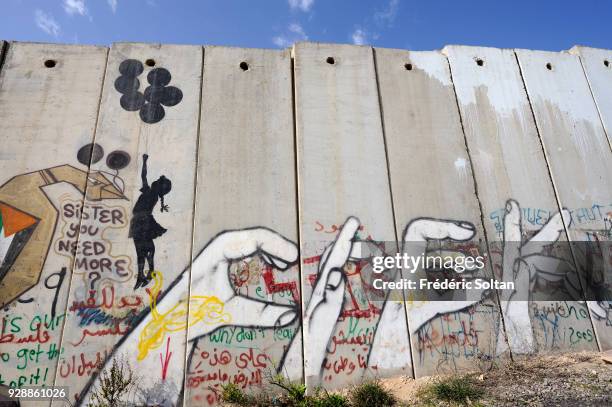 Mural on wall at Qalandia Checkpoint. Political and social mural painting and graffitis on the Israeli West Bank barrier, at the Qalandia checkpoint...