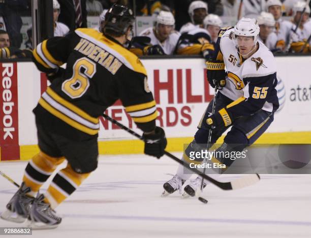 Jochen Hecht of the Buffalo Sabres heads for the net as Dennis Wideman of the Boston Bruins defends on November 7, 2009 at the TD Garden in Boston,...