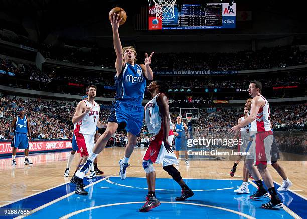 Dirk Nowitzki of the Dallas Mavericks goes in for the layup against the Toronto Raptors during a game at the American Airlines Center on November 7,...