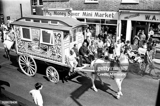 John Lennon's gaily painted gipsy caravan, on its way to his home, Monday 24th July 1967. Painted bright yellow with hand painted flower designs in...