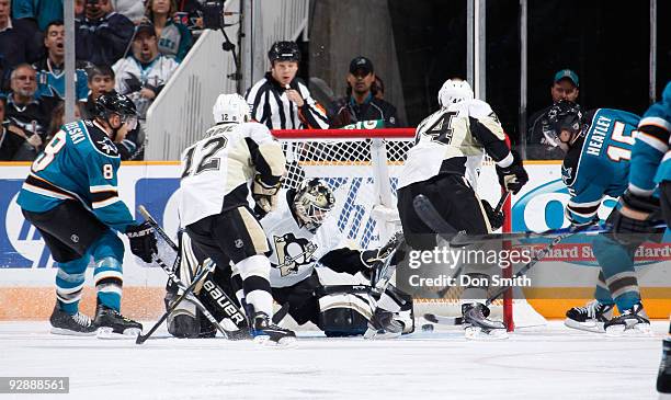 Christopher Bourque, Chris Kunitz and Marc-Andre Fleury of the Pittsburgh Penguins search for the puck while Dany Heatley of the San Jose Sharks...