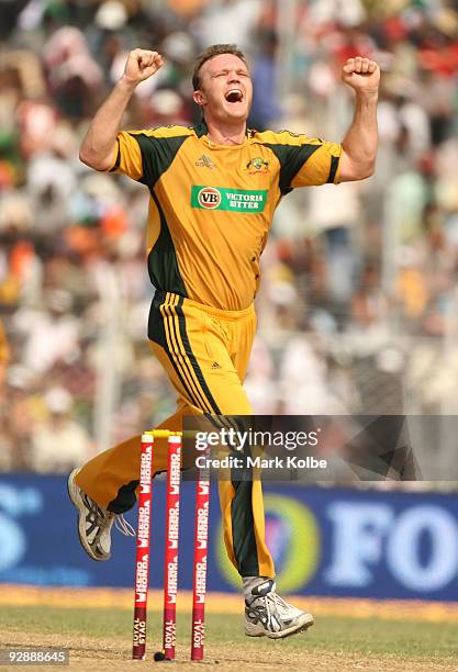 Doug Bollinger of Australia celebrates after taking the wicket of MS Dhoni of India during the sixth One Day International match between India and...