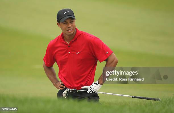 Tiger Woods of the USA looks despondent after a bunker shot on the seventh hole during the final round of the WGC - HSBC Champions at Sheshan...
