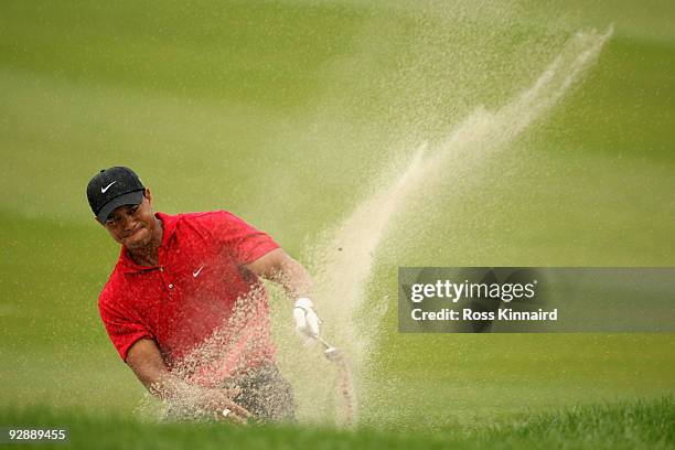 Tiger Woods of the USA hits a bunker shot on the seventh hole during the final round of the WGC - HSBC Champions at Sheshan International Golf Club...
