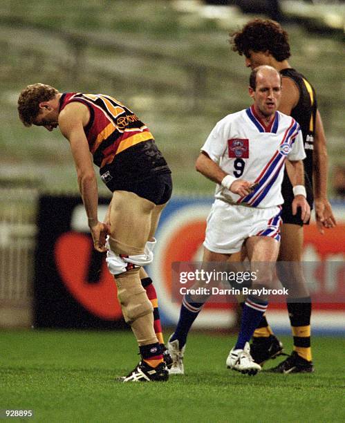 Brett Burton for Adelaide pulls his shorts back up during round eight of the AFL season match played between the Richmond Tigers and the Adelaide...