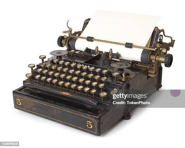 a old antique typewriter with blank paper - typewriter stockfoto's en -beelden