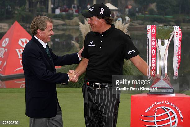 Tim Finchem, Commissioner of the PGA TOUR and Phil Mickelson of the USA with the winners trophy after the final round of the WGC - HSBC Champions at...