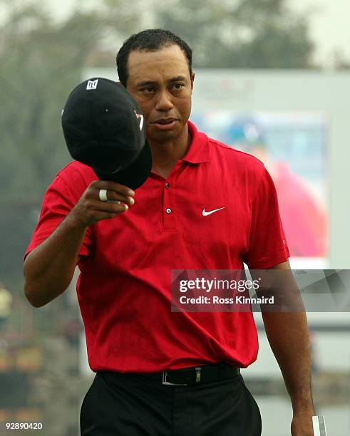 Tiger Woods of the USA on the 18th green during the final round of the WGC - HSBC Champions at Sheshan International Golf Club on November 8, 2009 in...