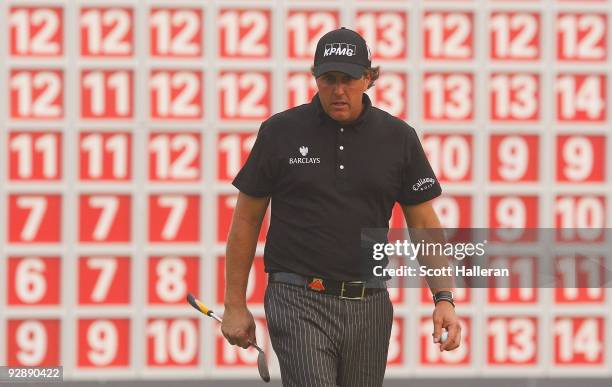 Phil Mickelson of the USA walks across the 18th green during the final round of the WGC-HSBC Champions at Sheshan International Golf Club on November...