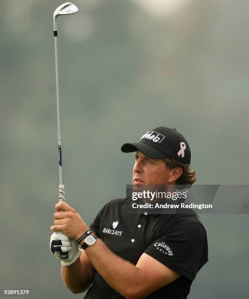 Phil Mickelson of the USA hits his second shot on the 13th hole during the final round of the WGC-HSBC Champions at Sheshan International Golf Club...