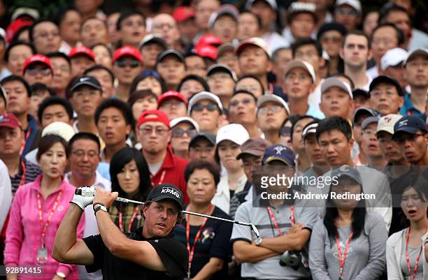 Phil Mickelson of the USA plays a shot on the 16th hole during the final round of the WGC-HSBC Champions at Sheshan International Golf Club on...