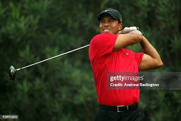 Tiger Woods of the USA watches his tee-shot on the 18th hole during the final round of the WGC-HSBC Champions at Sheshan International Golf Club on...