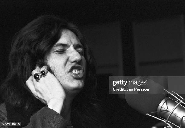 English singer David Coverdale of Deep Purple singing into a studio microphone in a recording studio, Copenhagen, Denmark, 1973.