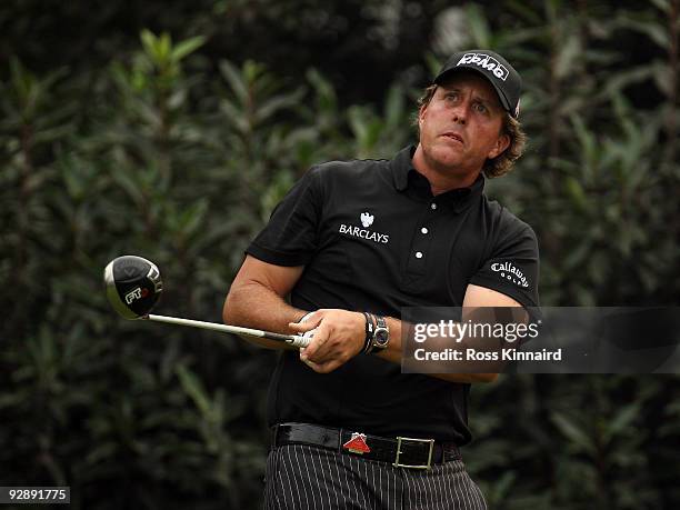 Phil Mickelson of the USA watches his tee shot on the fourth hole during the final round of the WGC - HSBC Champions at Sheshan International Golf...