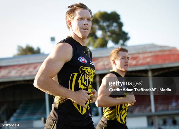 Jack Riewoldt of the Tigers runs onto the field with Jacob Townsend of the Tigers during the AFL 2018 JLT Community Series match between the Richmond...