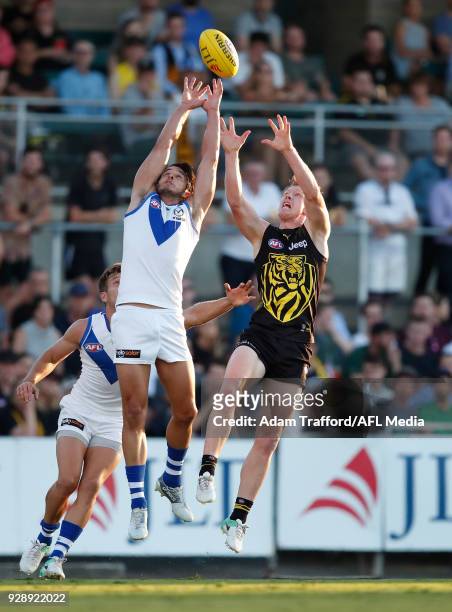 Jack Riewoldt of the Tigers and Robbie Tarrant of the Kangaroos compete for the ball during the AFL 2018 JLT Community Series match between the...