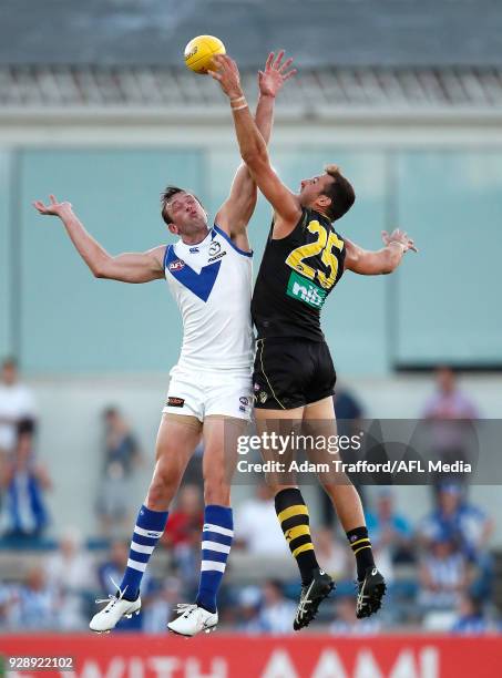 Todd Goldstein of the Kangaroos and Toby Nankervis of the Tigers compete in a ruck contest during the AFL 2018 JLT Community Series match between the...
