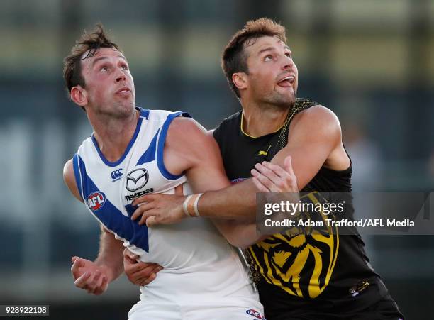 Todd Goldstein of the Kangaroos and Toby Nankervis of the Tigers compete in a ruck contest during the AFL 2018 JLT Community Series match between the...