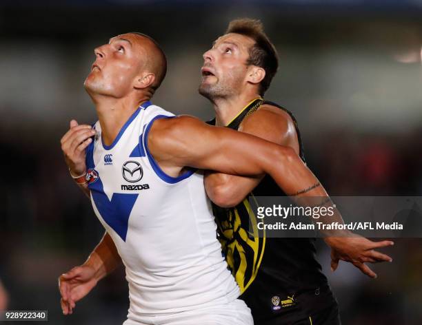 Braydon Preuss of the Kangaroos and Toby Nankervis of the Tigers compete in a ruck contest during the AFL 2018 JLT Community Series match between the...