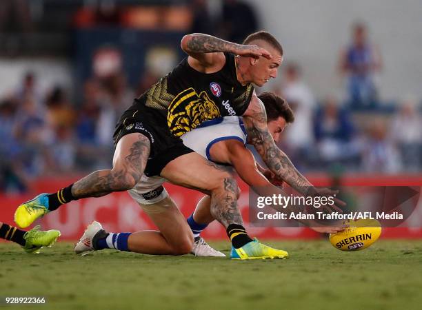 Dustin Martin of the Tigers and Luke Davies-Uniacke of the Kangaroos compete for the ball during the AFL 2018 JLT Community Series match between the...