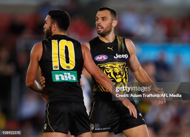 Sam Lloyd of the Tigers celebrates a goal with Shane Edwards of the Tigers during the AFL 2018 JLT Community Series match between the Richmond Tigers...