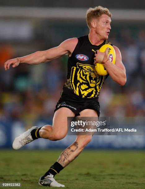 Josh Caddy of the Tigers in action during the AFL 2018 JLT Community Series match between the Richmond Tigers and the North Melbourne Kangaroos at...
