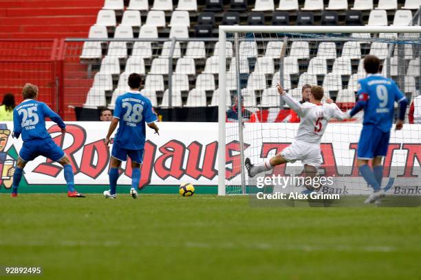 Michael Blum of Karlsruhe scores his team's first goal against Christian Stuff of Berlin during the Second Bundesliga match between Karsruher SC and...