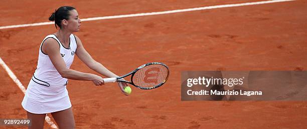 Flavia Pennetta of Italy serves against Melanie Oudin of USA during the final of the Fed Cup World Group between Italy and the USA at Circolo Tennis...