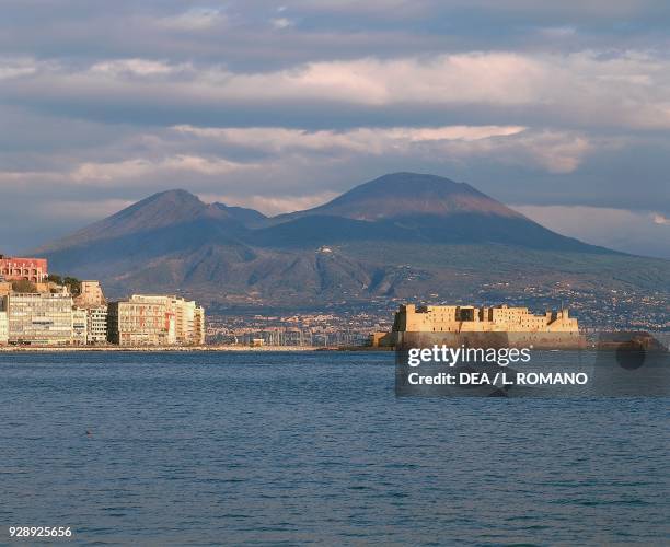 Castel dell'Ovo, 1st century BC; in the background the Mount Vesuvius, Naples, Campania, Italy.