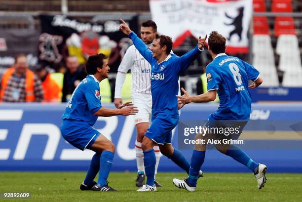 Anton Fink of Karlsruhe celebrates his team's second goal with team mates Andreas Schaefer and Michael Mutzel during the Second Bundesliga match...