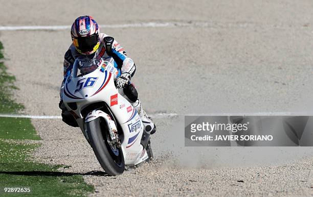 Russian Vladimir Leonov drives off the tracj during the 250cc race of the Valencia motorcycling Grand Prix at the Ricardo Tormo race track in Cheste,...