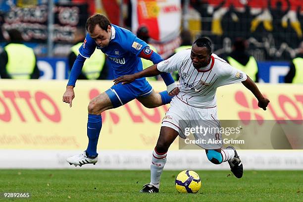 Marc Younga-Mouhani of Berlin is challenged by Alexander Iashvili of Karlsruhe during the Second Bundesliga match between Karsruher SC and Union...