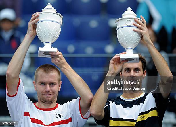 Frantisek Cermak of the Czech Republic and Michal Mertinak of Slovakia hold their trophies aloft during the doubles final of the ATP 500 World Tour...