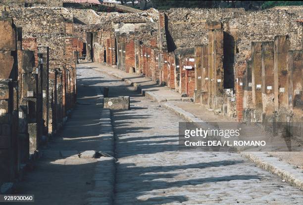 Ruins of houses along via dell'Abbondanza, Pompeii , Italy. Roman civilization.