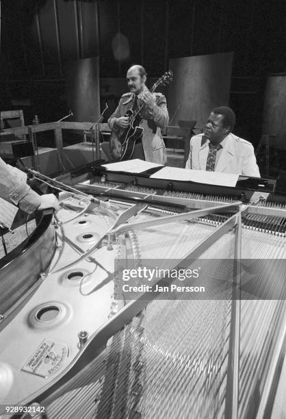 American jazz pianist Oscar Peterson and American guitarist Joe Pass at a television recording in Copenhagen, Denmark, 1980.