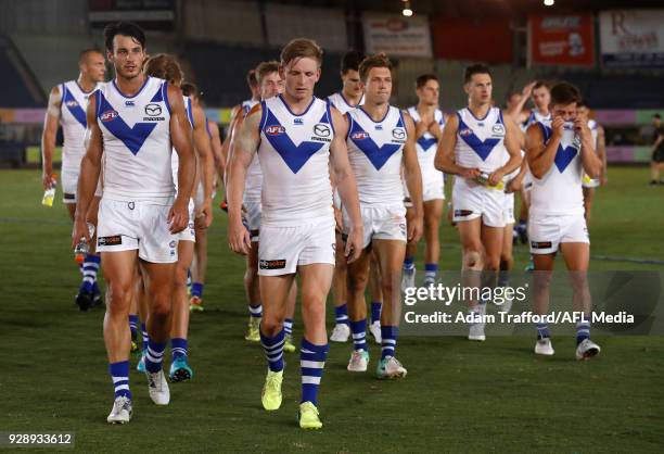 Robbie Tarrant and Jack Ziebell of the Kangaroos leave the field after a loss during the AFL 2018 JLT Community Series match between the Richmond...