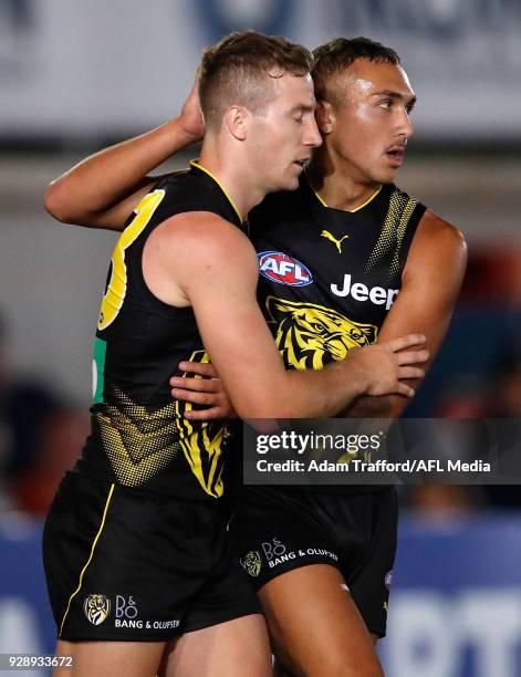 Shai Bolton of the Tigers celebrates with Kane Lambert of the Tigers during the AFL 2018 JLT Community Series match between the Richmond Tigers and...